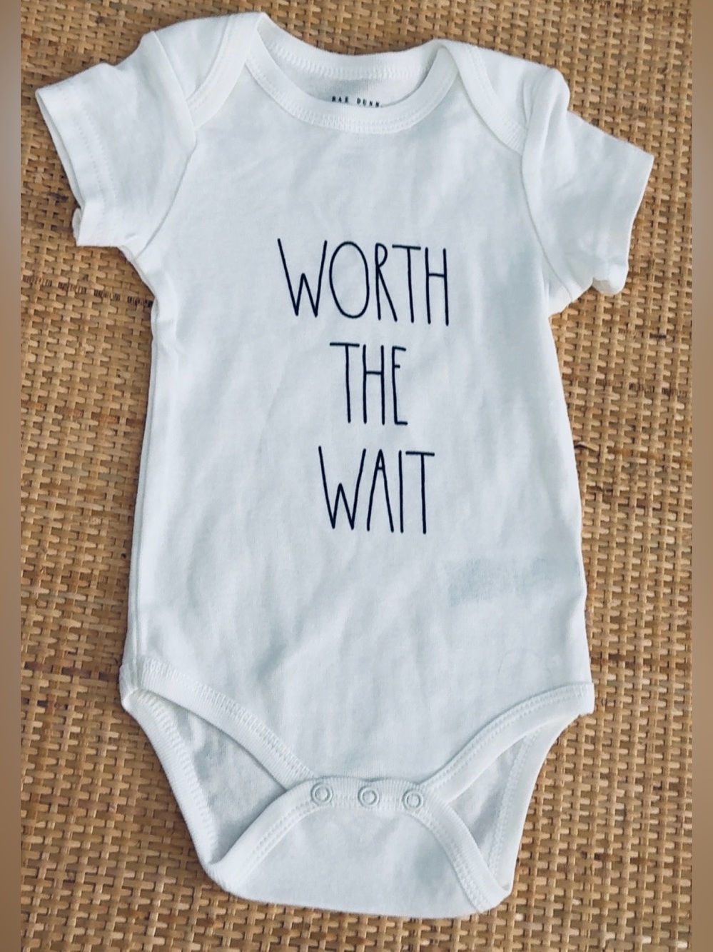 Rae Dunn “Worth The Wait” White Baby Onesie• New• Size 6-9 months